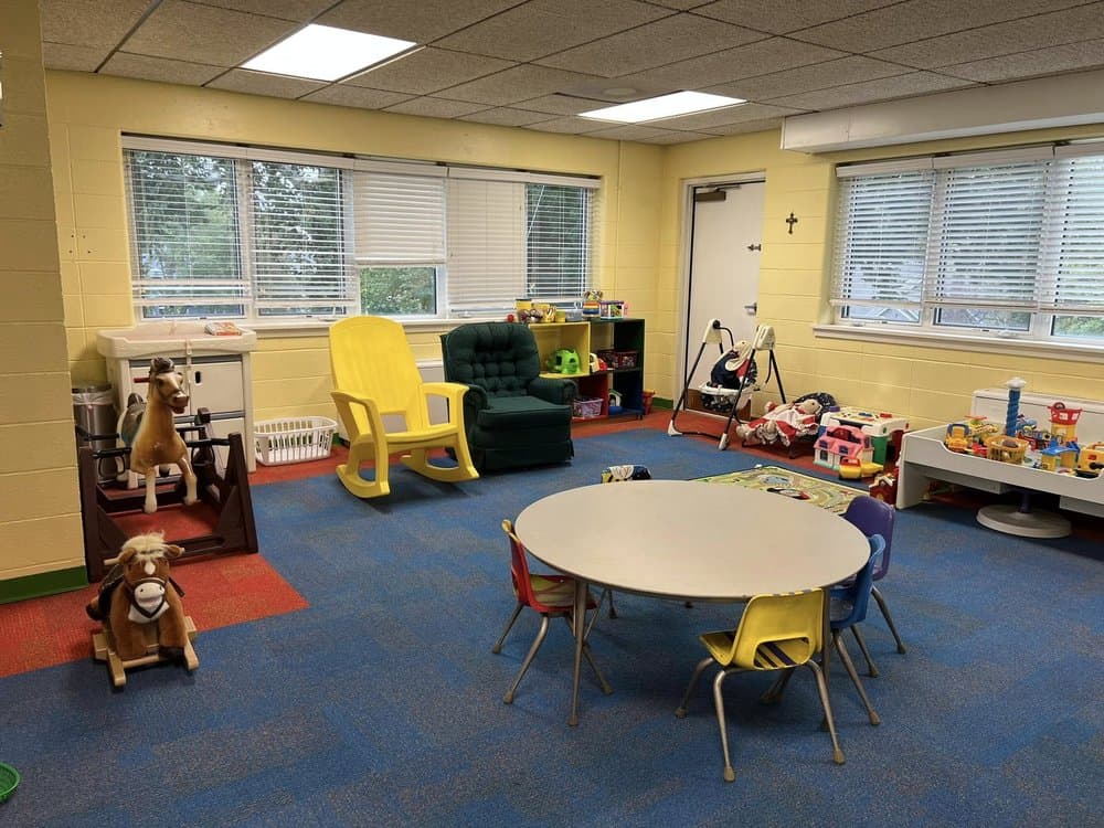 Good Shepherd nursery room — bright, cheerful, and fully equipped
